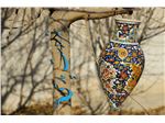 Hanging pot with a height of 40 cm of clay with enamel designs on pottery